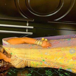 Ethic Indian attire, yellow with purple, size 42 choli, lengha large.